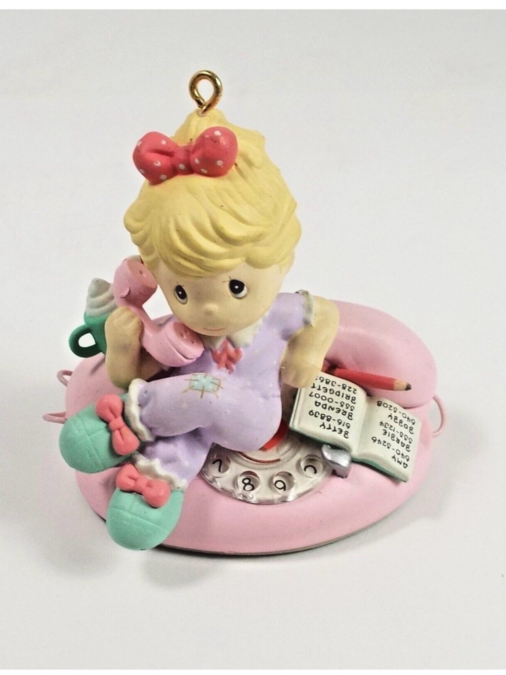 Precious Moments 1994Girl on Pink Phone with Lavender Outfit .